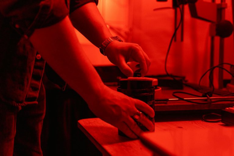 Person Holding Black Ceramic Mug